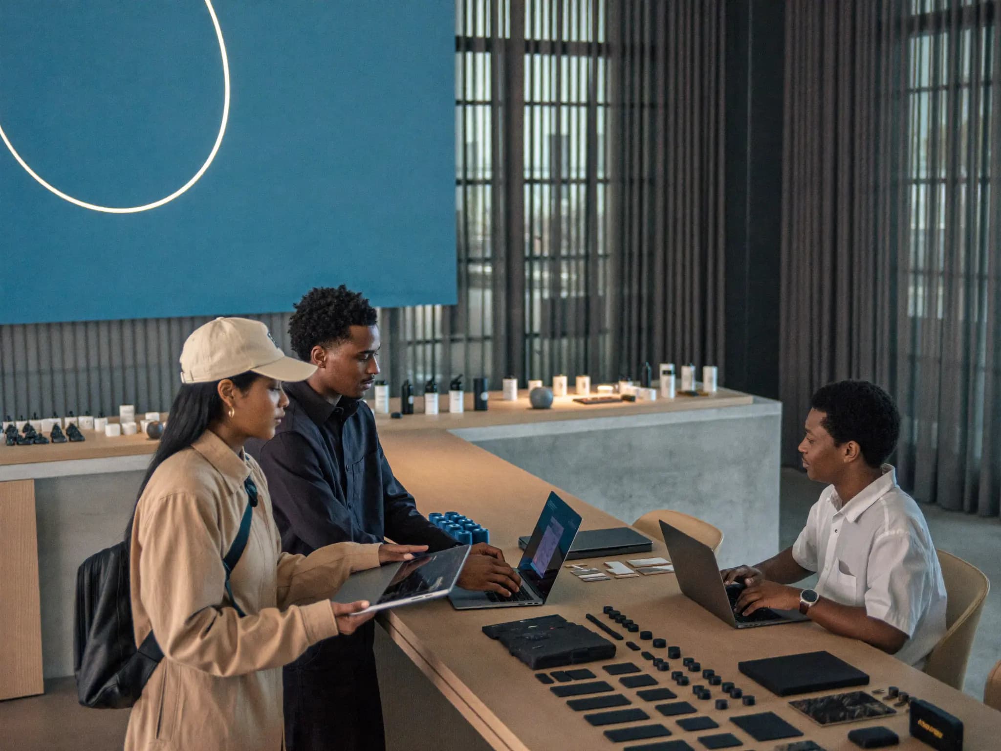 Business meeting with laptops and products